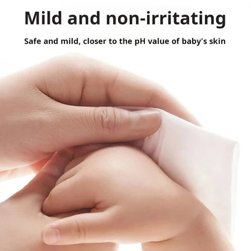 Close-up of a hand holding a baby's hand with text about product safety and pH value.