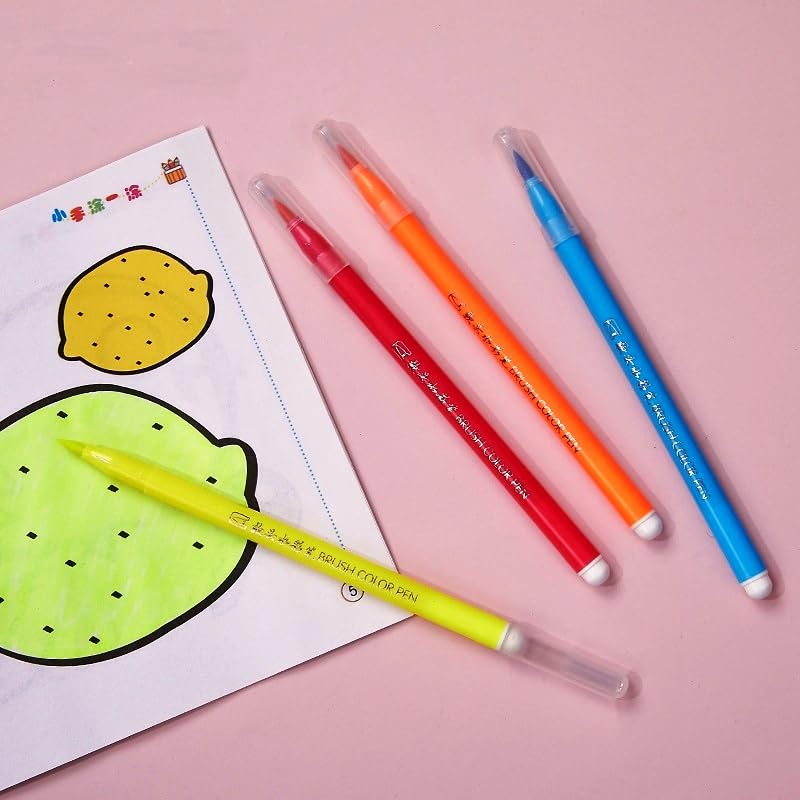 Colorful markers on a pink background with a drawing of a lemon and lime.