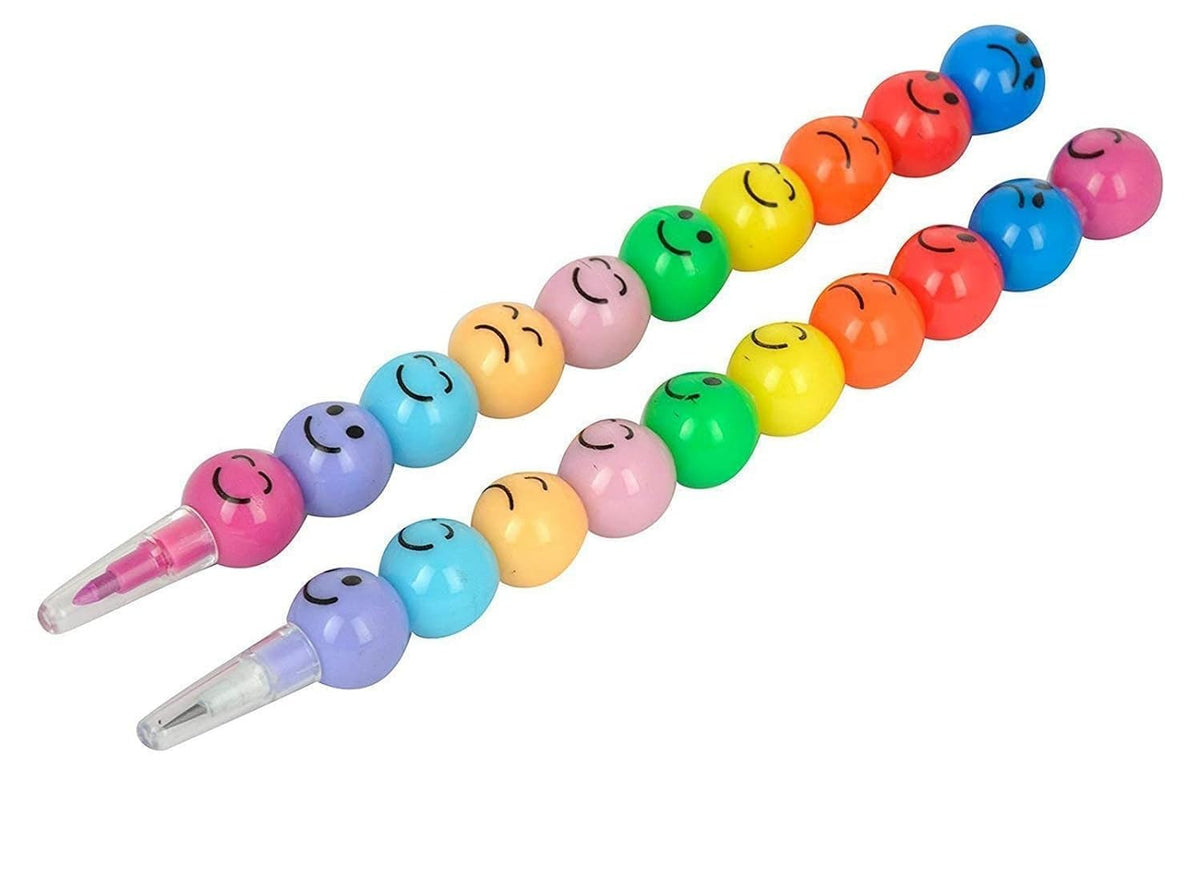 Colorful hair clips with smiley face designs on a white background