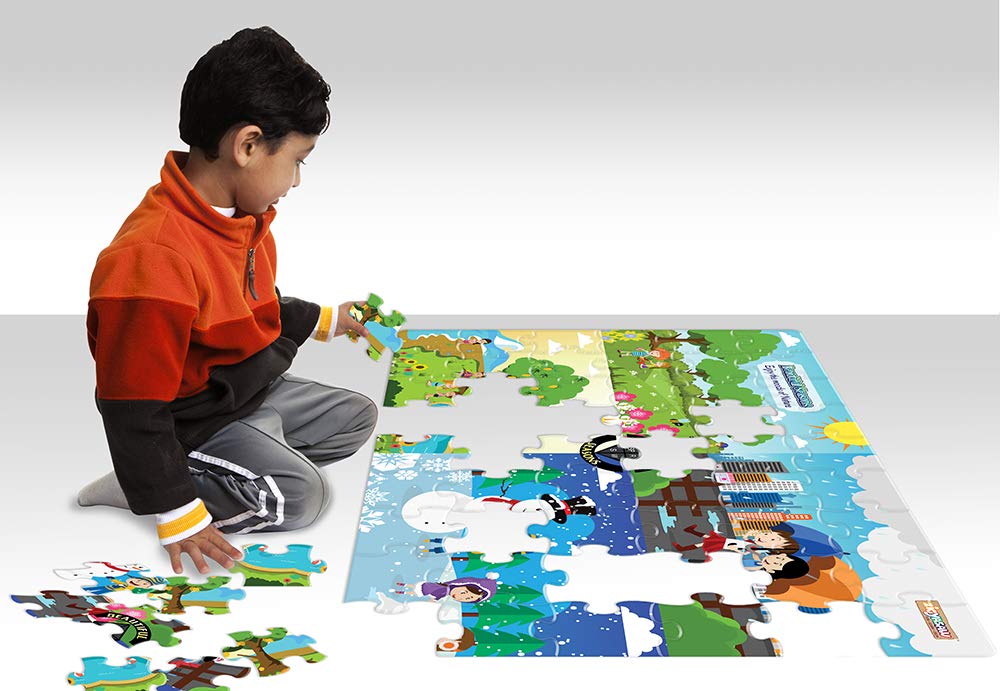 Child playing with a puzzle on a large mat featuring cartoon characters.