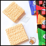 Two square crackers and three colorful packages of Qihao brand on a white background.