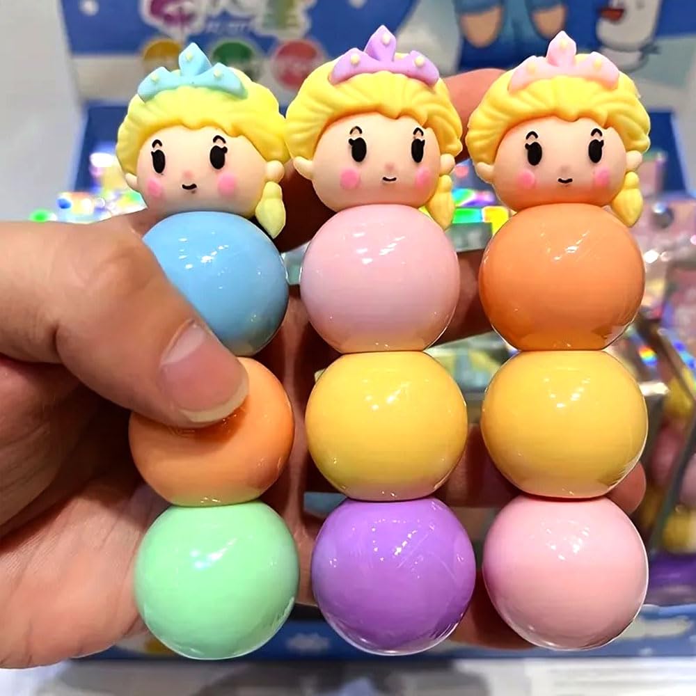 Colorful toy beads with princess-themed tops held by a hand against a blurred background.