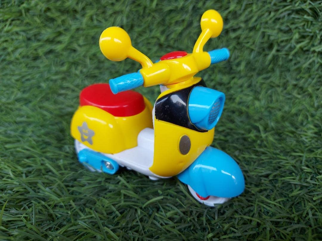 Toy vehicle with a yellow and blue design on a grassy background