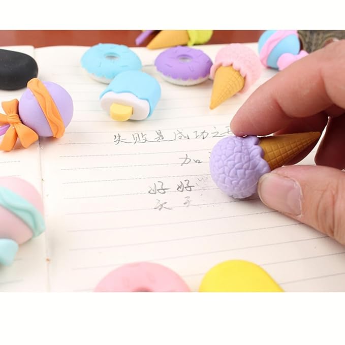 Colorful ice cream-shaped erasers on a notebook page.