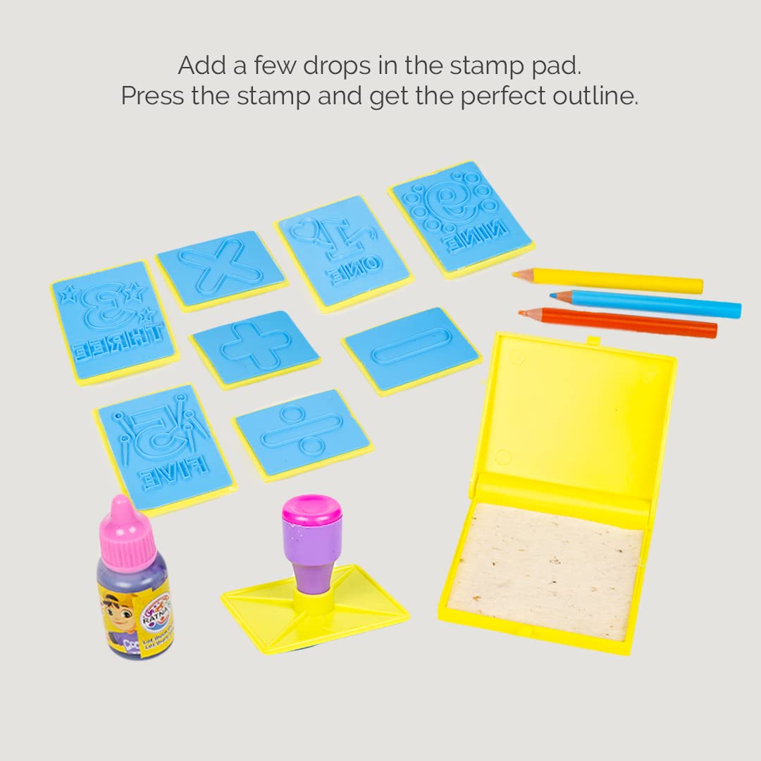 Stamping kit with stamp pads, ink bottle, and stamps on a light gray background