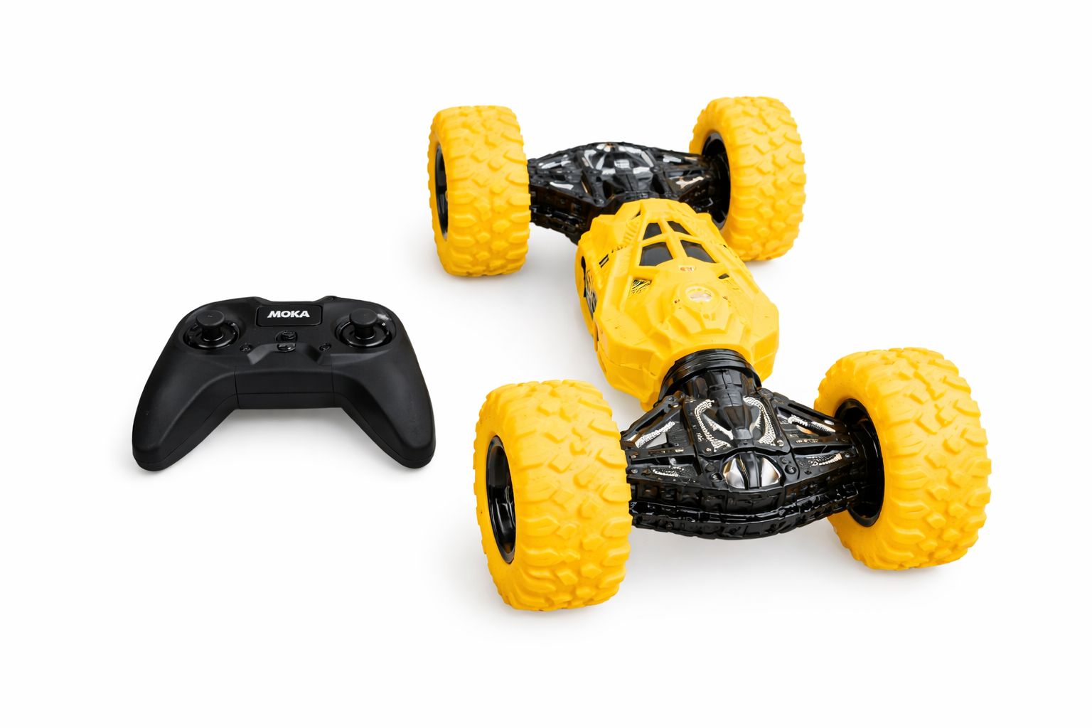 Yellow toy car with large wheels and a black remote control on a white background