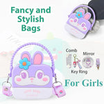 Fancy and stylish bag with bunny design, comb, mirror, and key ring on a white background.