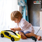 Child playing with a yellow toy car on a bed, with 'GOOYO' branding visible.