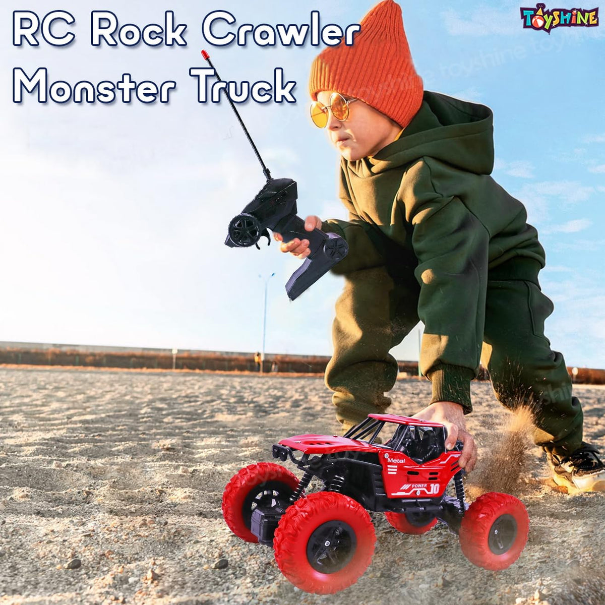 Child playing with an RC rock crawler monster truck on a clear day.
