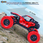 Red toy off-road vehicle climbing a rocky slope with text highlighting its climbing ability.