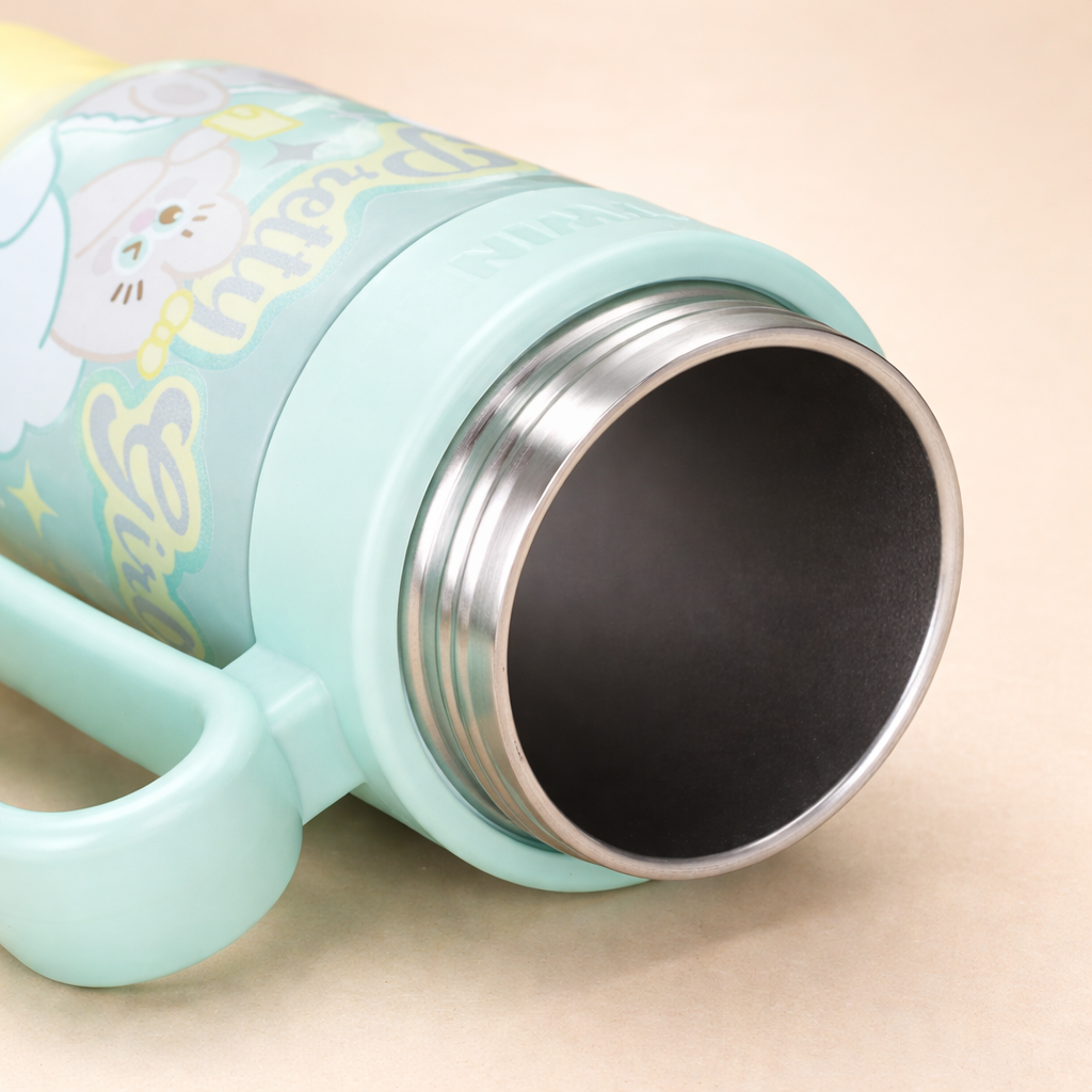 Teal insulated mug with floral design on a beige background