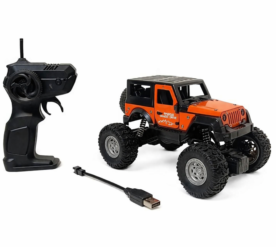 Orange and black remote control toy truck with USB cable on a white background
