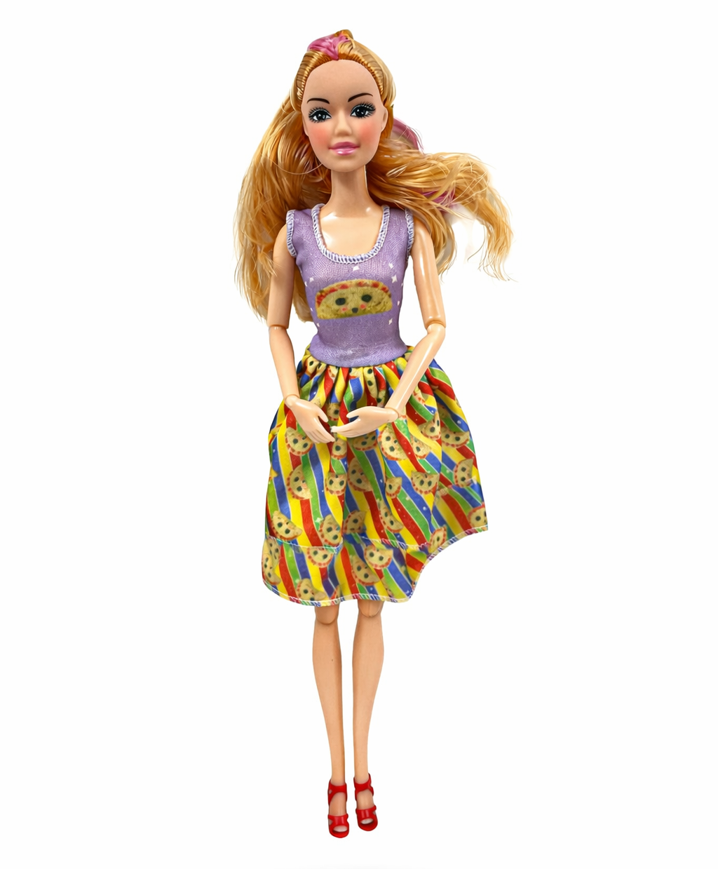 Barbie doll wearing a colorful dress with a pattern on a white background