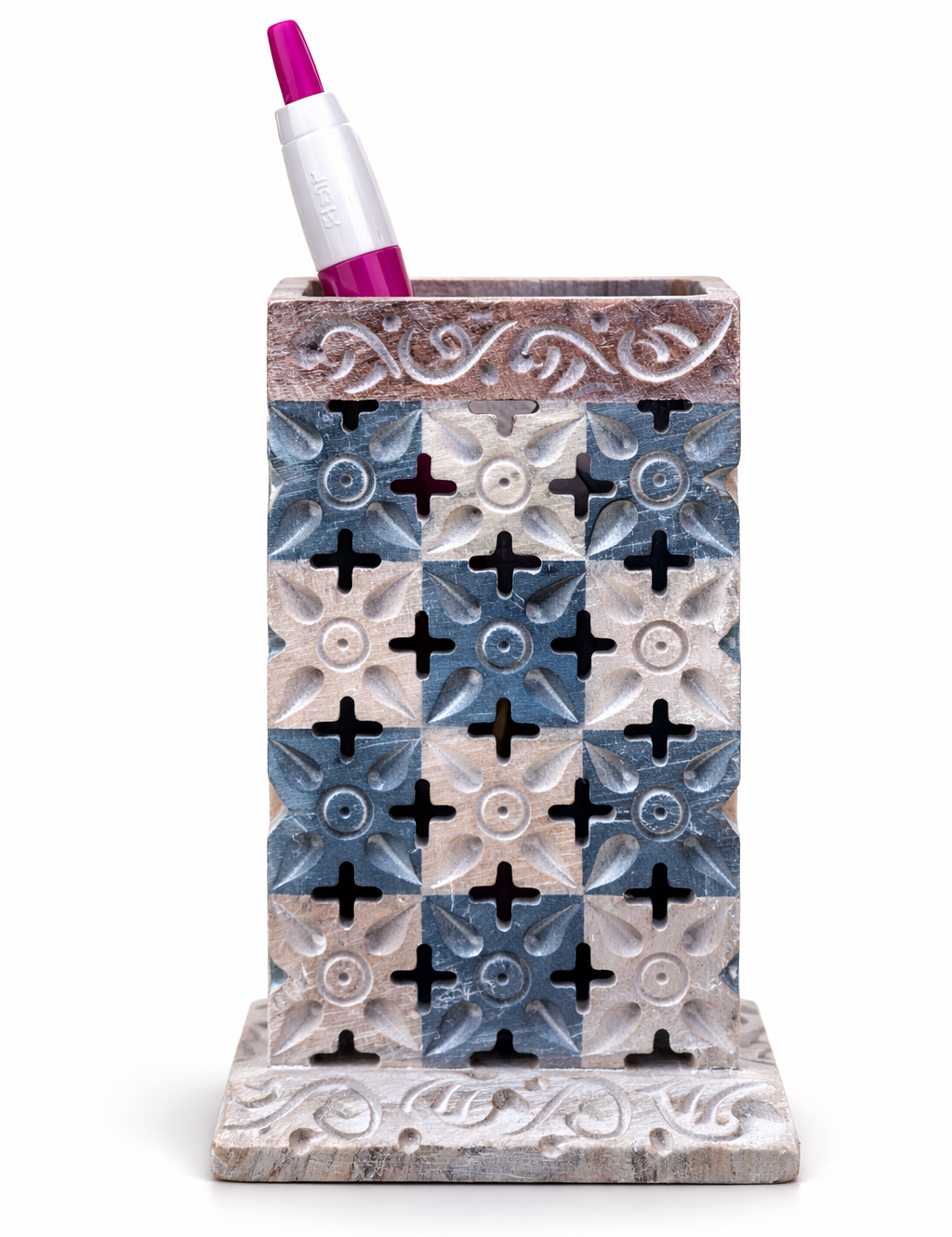 Decorative pen holder with a patterned design on a white background