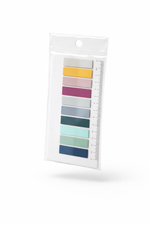 Color swatch card with various colors in a clear plastic package on a white background