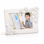 White photo frame with decorative elements on a white background