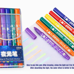 Set of colorful markers with glowing effect on a white background