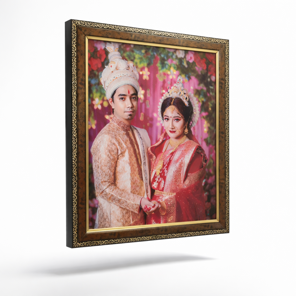 Framed photograph of a couple in traditional wedding attire with a decorative gold frame.