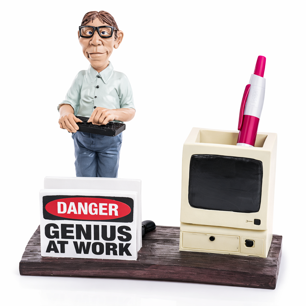 Desk organizer with a small figure, TV-shaped pen holder, and 'Danger: Genius at Work' sign.