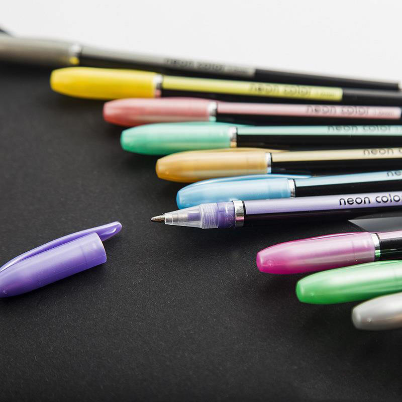Colorful markers on a black background