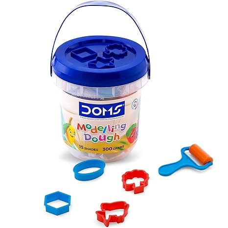 DOMS modeling dough set with a bucket, tools, and colorful shapes on a white background