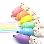 Colorful highlighters with cartoon animal designs on a white background