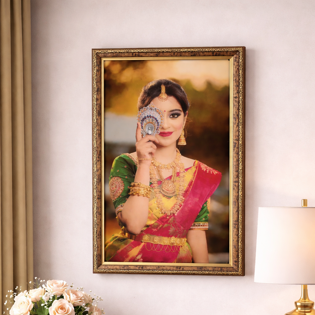 Framed portrait of a woman in traditional attire on a wall above a wooden console table with decor items.
