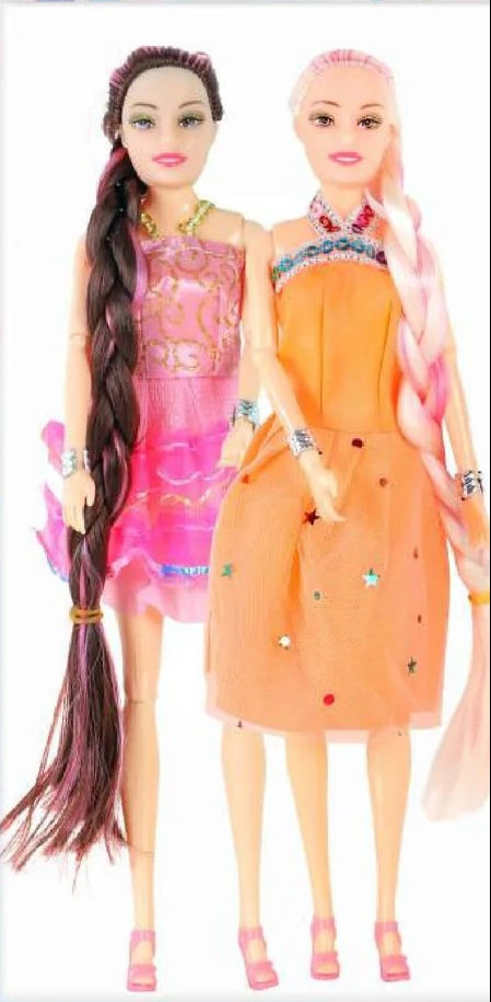 Two dolls with colorful outfits standing next to each other on a white background