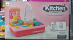 Toy kitchen set packaging with pink and white colors