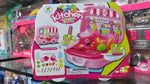 Toy kitchen set packaging with colorful design on a store shelf.