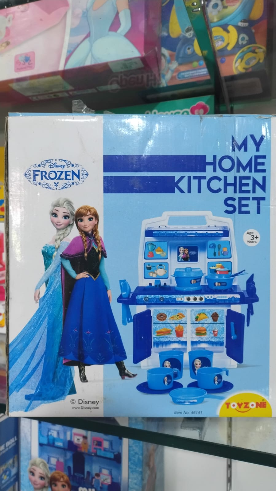 Frozen-themed toy kitchen set packaging on a shelf