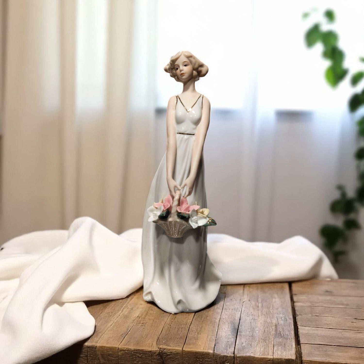  Elegant girl showpiece with flower basket – front view – ceramic white – Motumal Giftwala Ranchi