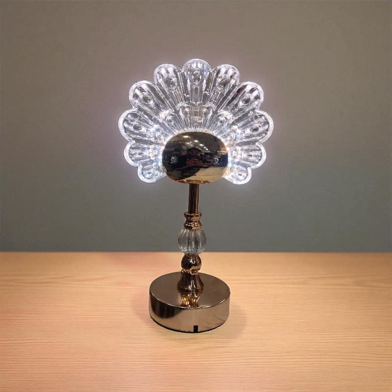 Decorative lamp with crystal design on a wooden surface and gray background
