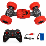 Red remote control car with controller, USB cable, and battery on a white background