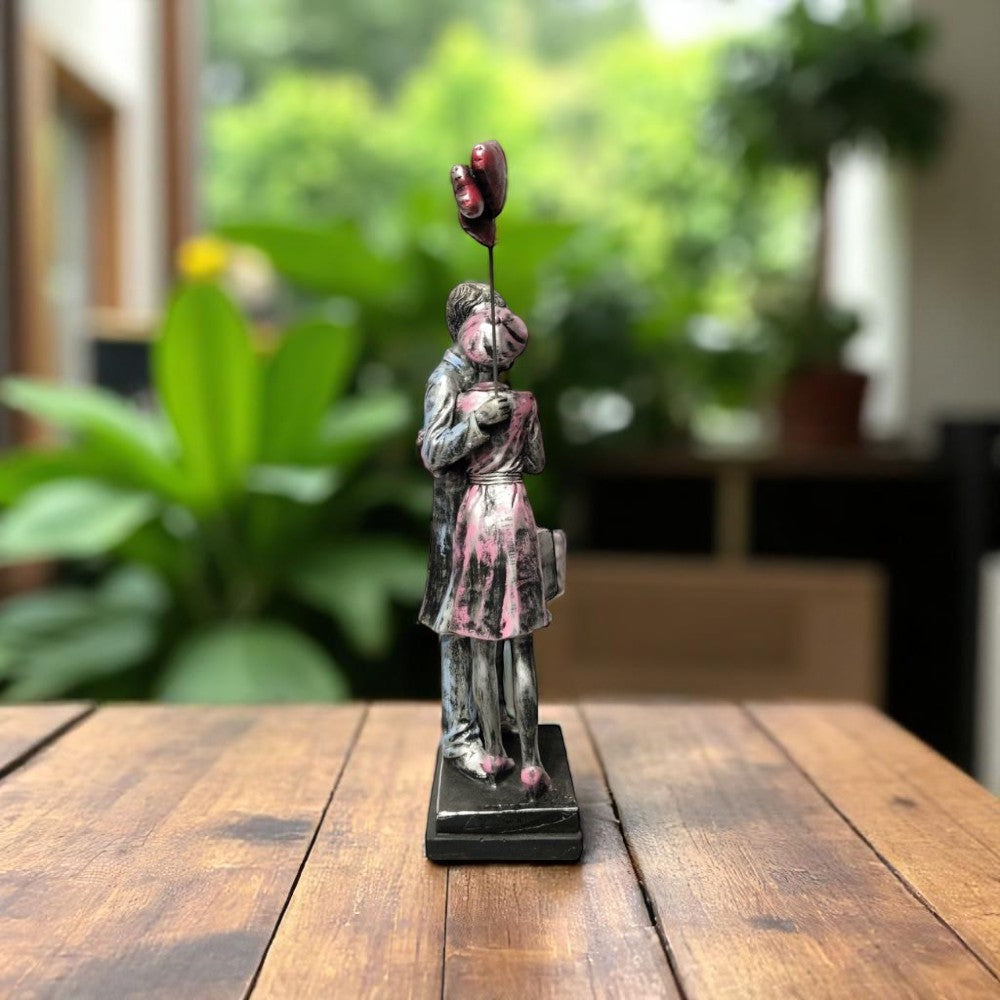 Romantic showpiece of couple hugging with suitcase and balloons - back view - Motumal Giftwala