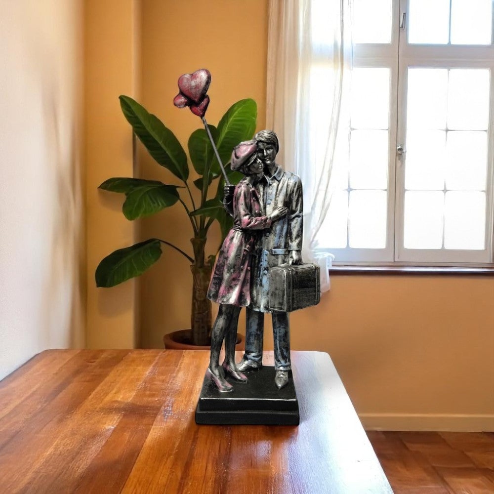 Front view of emotional goodbye couple showpiece - made in India - Motumal Giftwala