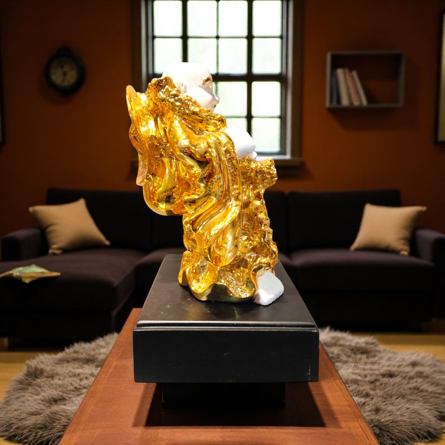 Side profile of white and golden Buddha showpiece with money bag