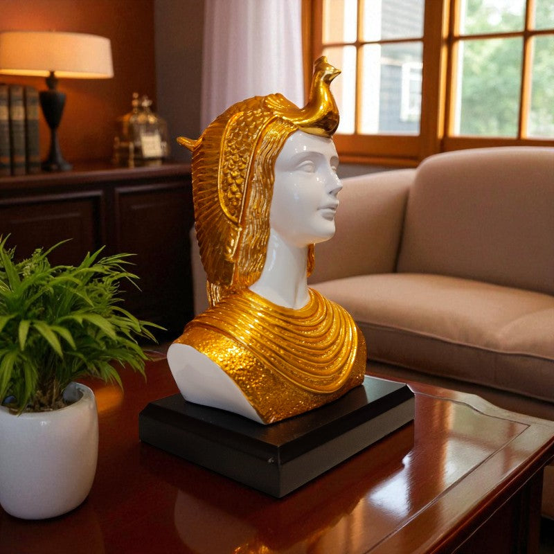Decorative bust with gold headpiece on a table in a living room setting