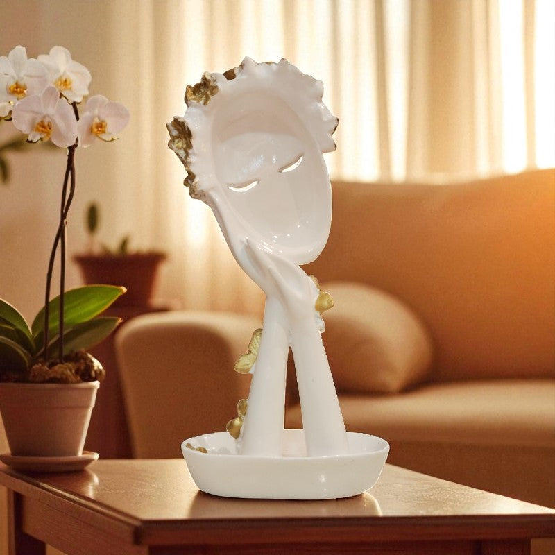 Decorative sculpture on a table with a blurred background