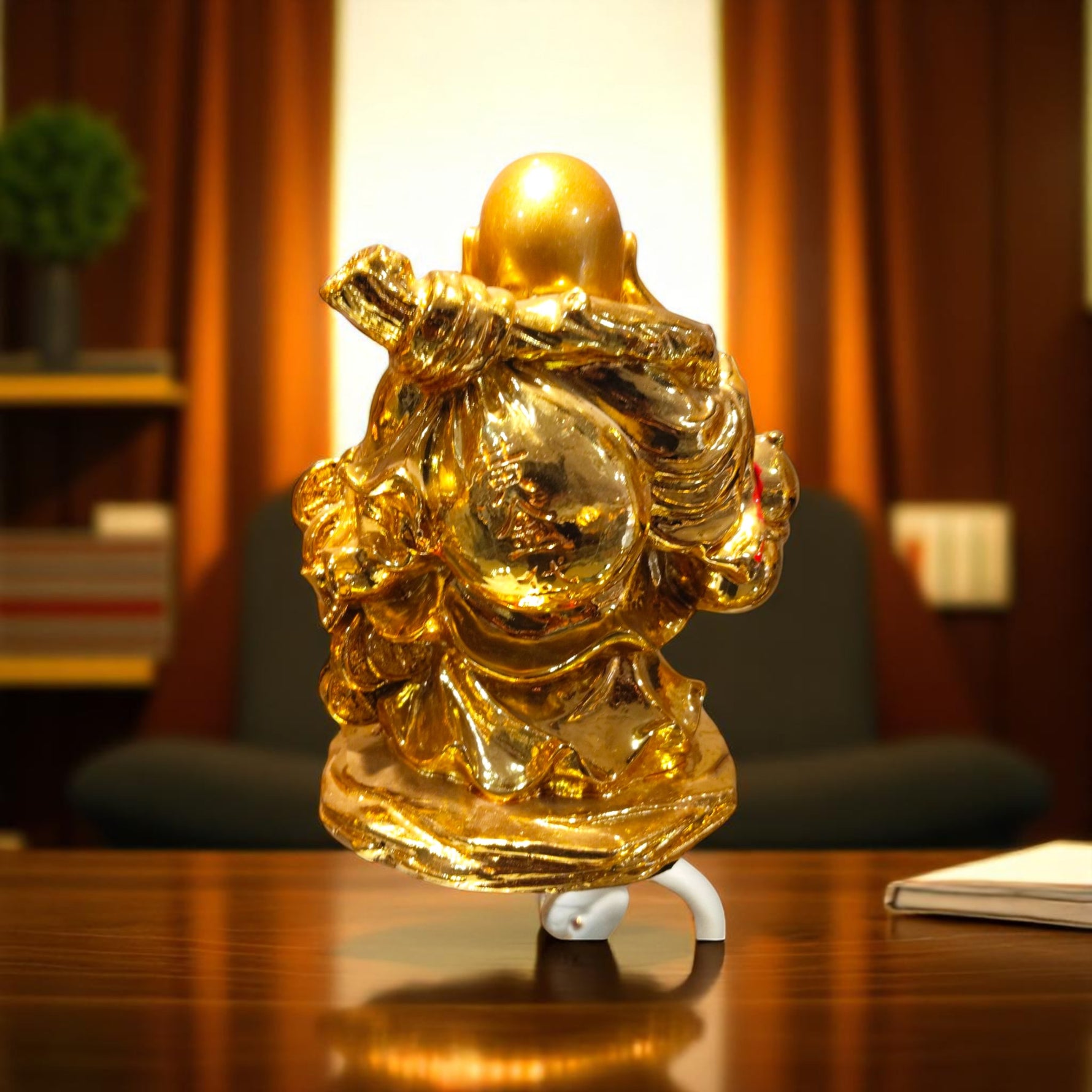 Back view of Lucky Laughing Buddha idol in golden robe