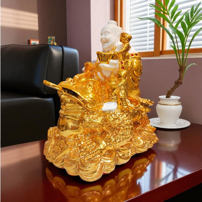 Gold Buddha statue on a table with a plant and chair in the background
