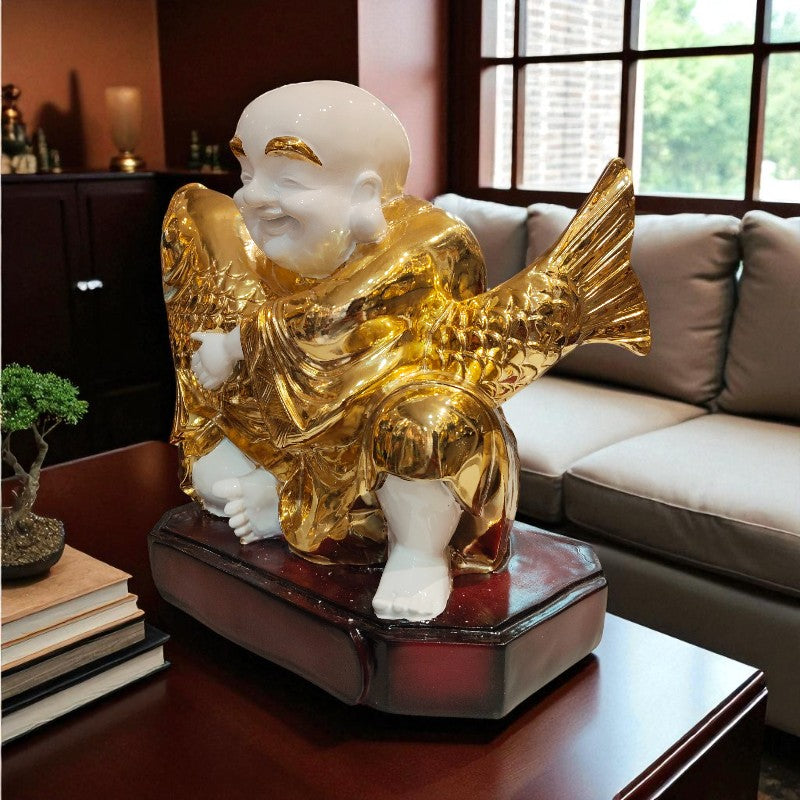 Gold fish-shaped incense burner on a wooden table with a soft focus background