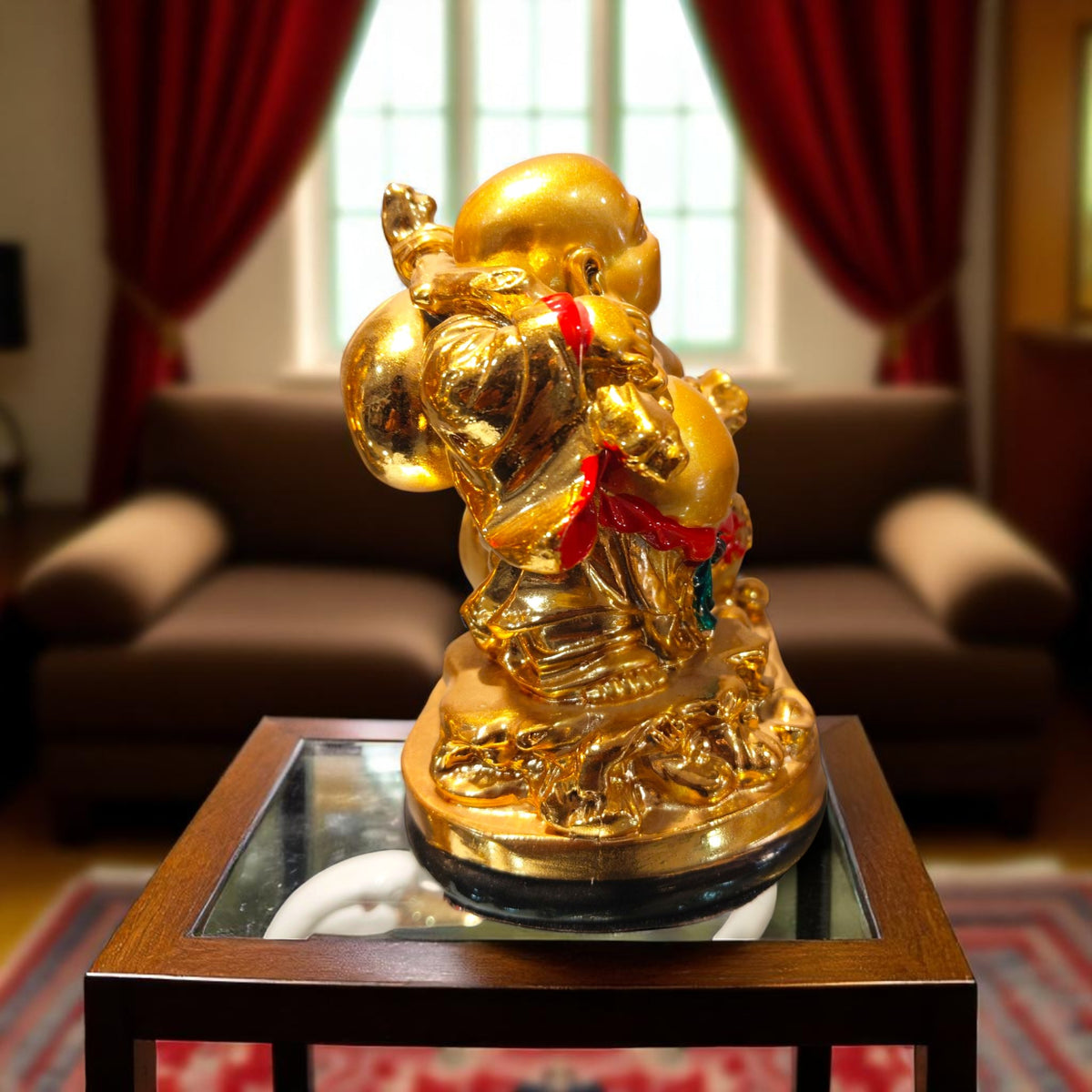 Side view of golden Laughing Buddha showpiece with money sack – perfect for gifting