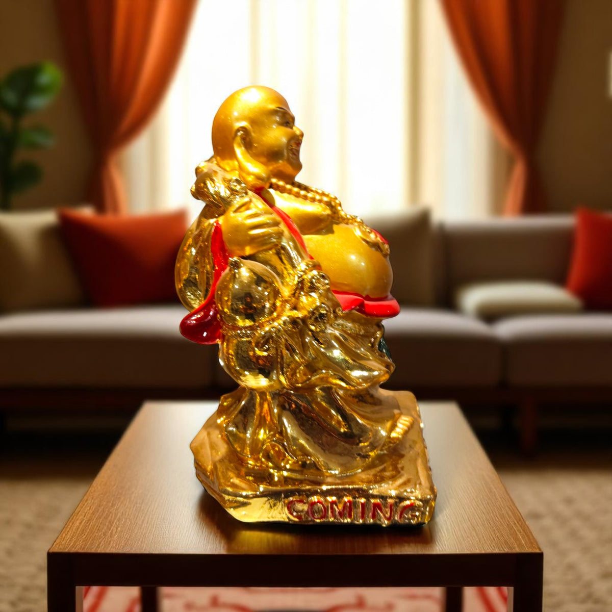 Side view of Golden Buddha statue holding sack of wealth
