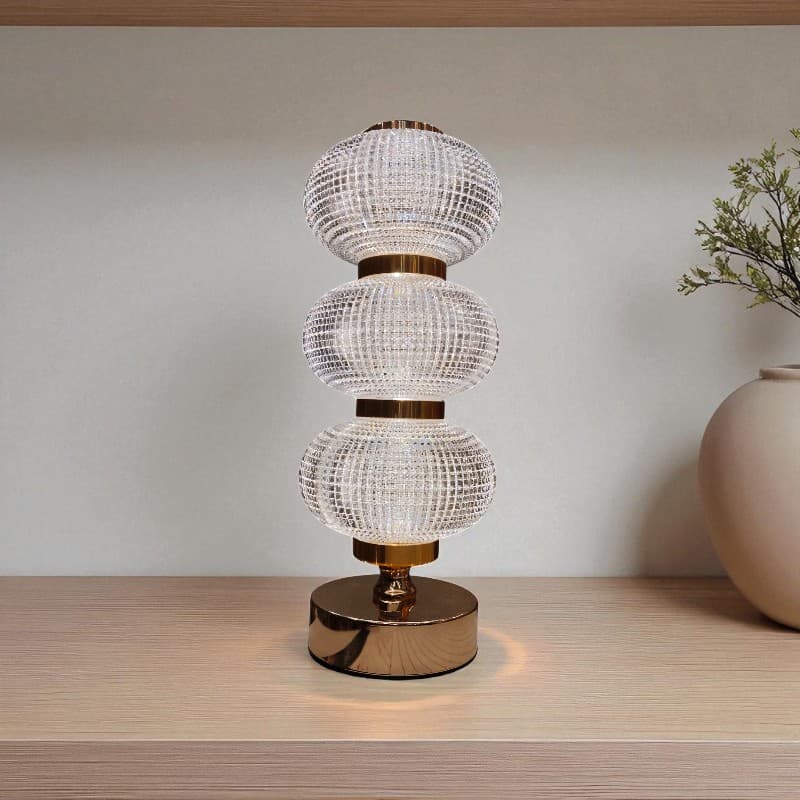 Decorative table lamp with crystal design on a wooden surface