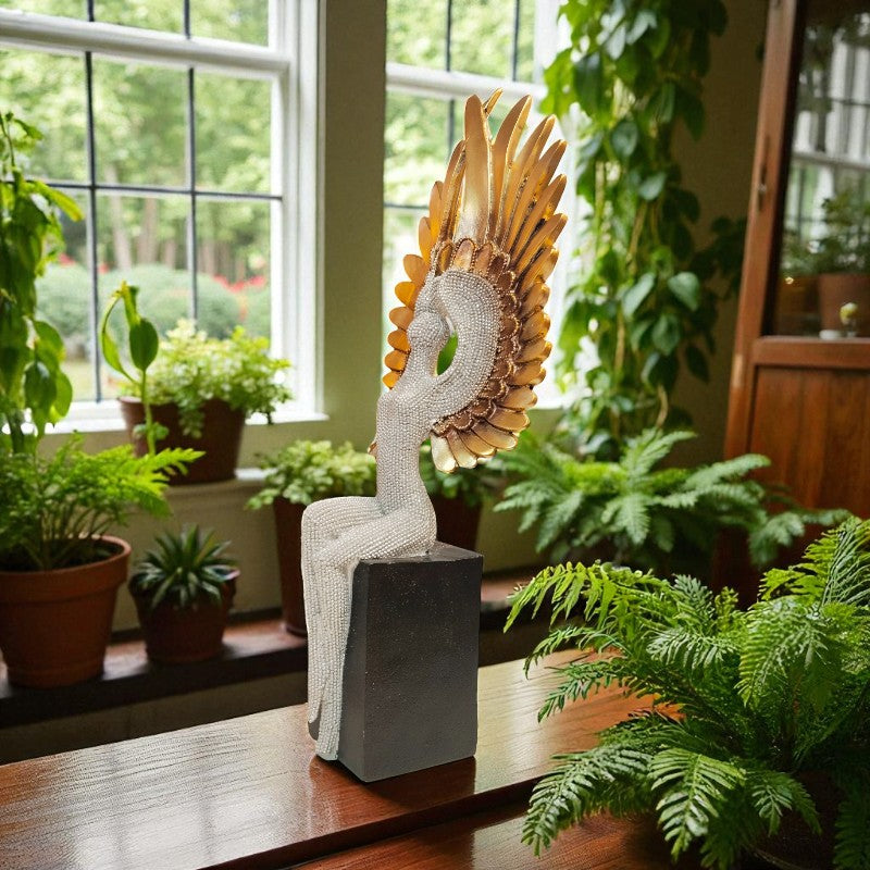 Decorative sculpture with a sunflower design in a room with plants