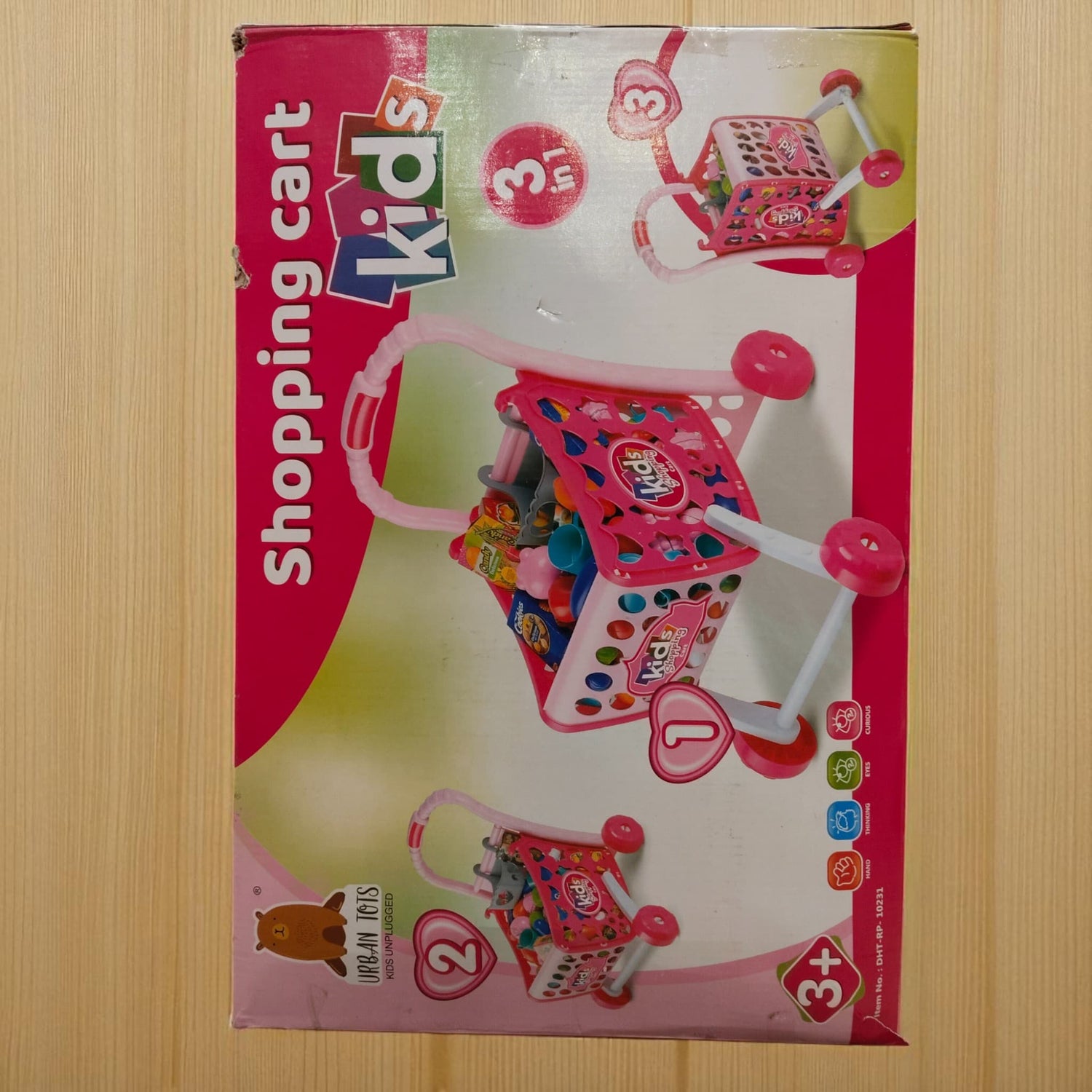 Top view of kids shopping cart toy set box showing shopping cart with fruits and groceries