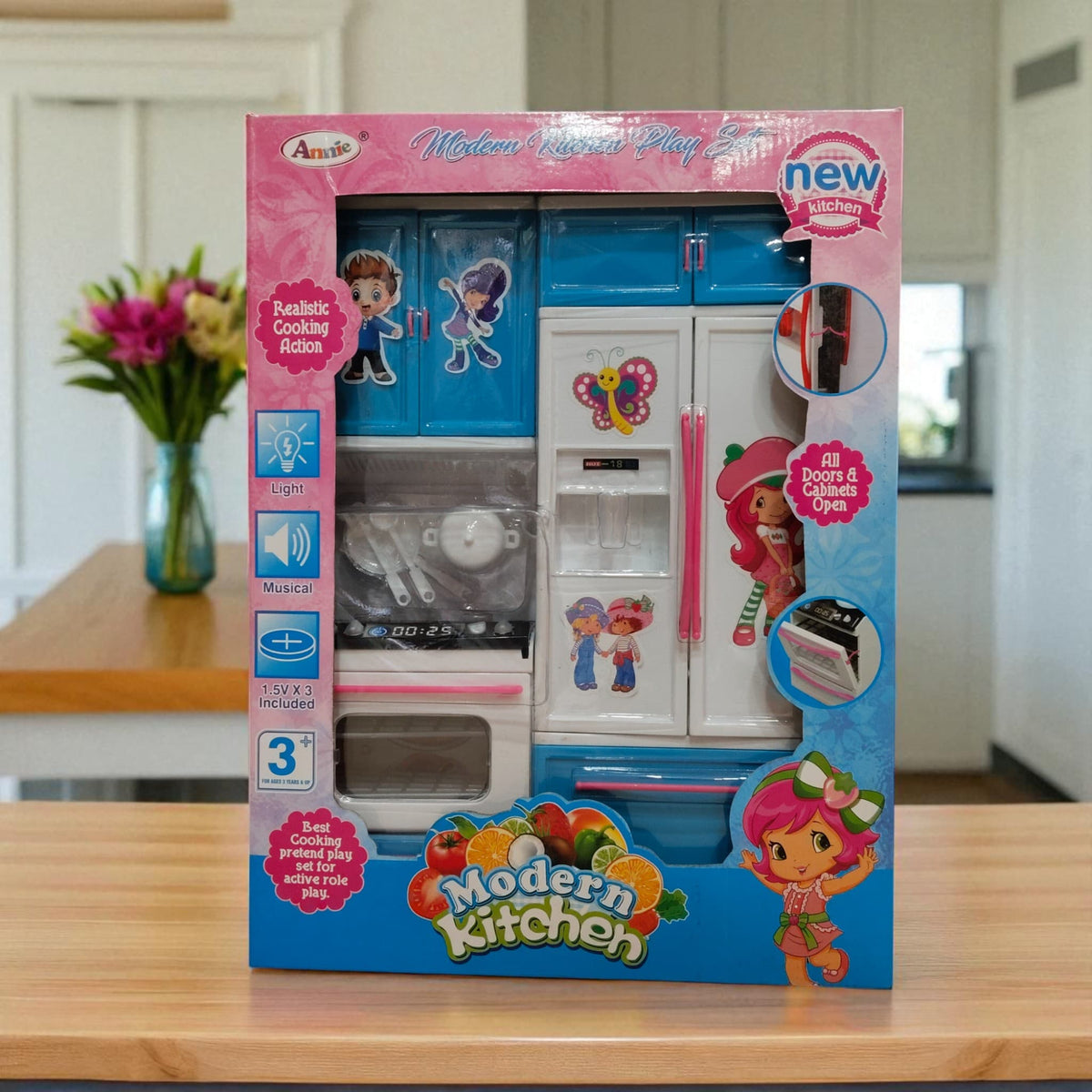 Front packaging of Annie Modern Kitchen Play Set showing realistic cooking action, light and musical features for kids.