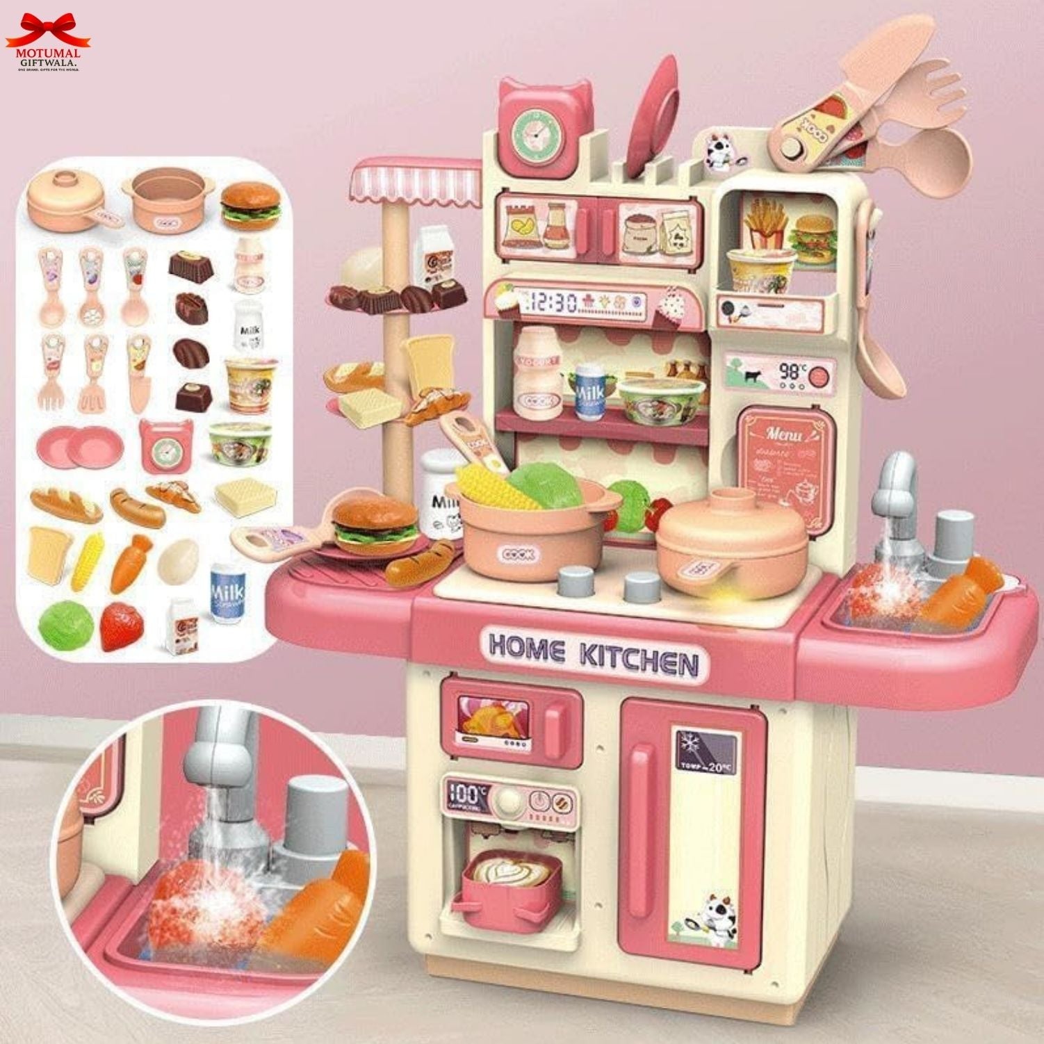 Toy kitchen set with various accessories on a pink background