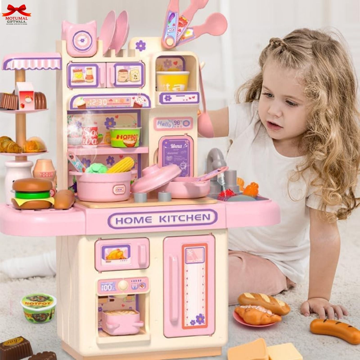Child playing with a toy kitchen set on a carpeted floor.